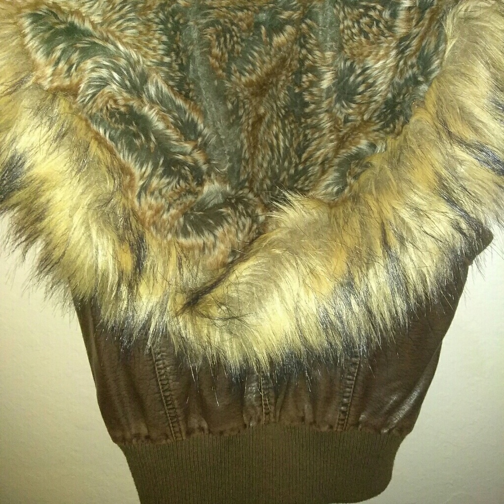 Cute womens faux leather vest with removable hood.
